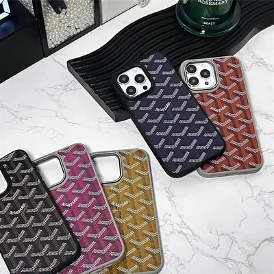 Three textured phone cases fanned out on a marble surface